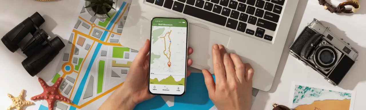 Hand holding a smartphone while searching for location